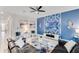 Living room with an accent wall, tile flooring, and modern decor at 4348 Quote St, Kissimmee, FL 34746