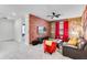 Well-lit living room showcasing a brick accent wall, TV, and ceiling fan at 4348 Quote St, Kissimmee, FL 34746