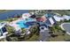An aerial view of a resort-style community pool, lounge area, and lush landscaping at 4348 Quote St, Kissimmee, FL 34746