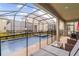 Screened-in pool and spa area with patio furniture at 4348 Quote St, Kissimmee, FL 34746