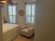Charming bedroom with plantation shutters, complemented by a ceiling fan and stylish furnishings at 806 Ebb Tide Ln, Poinciana, FL 34759
