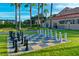 Inviting community space featuring a large outdoor chess set surrounded by mature landscaping at 806 Ebb Tide Ln, Poinciana, FL 34759