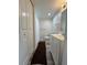 Bathroom featuring neutral wall paint, full-sized closet and shower at 6062 N Village Cir # Ge, Orlando, FL 32822