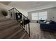 Living room with staircase, leading to cozy seating and a well-lit space at 6062 N Village Cir # Ge, Orlando, FL 32822