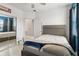 Cozy bedroom with a comfortable bed, mirrored closet, and plenty of natural light at 8541 Spyglass Ln, Davenport, FL 33896
