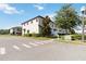 Well-maintained two-story townhome with manicured landscaping and a charming residential street at 8541 Spyglass Ln, Davenport, FL 33896