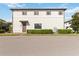 Attractive two-story townhome featuring a neat front yard, matching trim, and a welcoming entrance at 8541 Spyglass Ln, Davenport, FL 33896