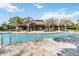 Beautiful community pool with elegant fountain features and covered seating area at 8541 Spyglass Ln, Davenport, FL 33896