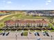 Aerial view of townhomes, highlighting the architecture, landscaping, parking, and surrounding community at 2774 Bella Vista Dr, Davenport, FL 33897