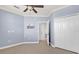 Open bedroom layout with fan, closet, and access to another room at 2774 Bella Vista Dr, Davenport, FL 33897