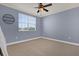 Well lit room with fan, neutral paint, and carpet at 2774 Bella Vista Dr, Davenport, FL 33897