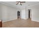 Empty bedroom featuring tile floor, ceiling fan, neutral wall and white trim at 2774 Bella Vista Dr, Davenport, FL 33897