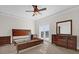 Spacious bedroom with a ceiling fan, carpet, and sliding doors to outside at 2774 Bella Vista Dr, Davenport, FL 33897