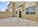 Exterior view of a home showing a stucco facade with a side patio featuring a paved surface at 2774 Bella Vista Dr, Davenport, FL 33897