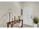 Entryway with white door, console table, lamps, and plants at 2774 Bella Vista Dr, Davenport, FL 33897