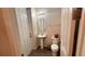 Cozy bathroom with pedestal sink, neutral tones, and a decorative mirror at 1515 Carey Palm Cir, Kissimmee, FL 34747