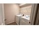 Functional laundry room with modern washer and dryer units at 1515 Carey Palm Cir, Kissimmee, FL 34747