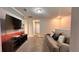 Relaxing living room with a plush couch and mounted TV for entertaining at 1515 Carey Palm Cir, Kissimmee, FL 34747