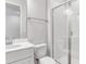 Clean bathroom with white vanity, toilet and a glass shower at 2930 Sharp Rd, Kissimmee, FL 34744