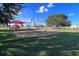 Playground with swings and shade structure at 340 Elderberry Ct, Kissimmee, FL 34759
