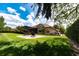 Spacious backyard with lounge chairs and lush landscaping at 9210 Southern Breeze Dr, Orlando, FL 32836