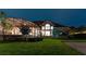 House exterior with screened-in patio at night at 9210 Southern Breeze Dr, Orlando, FL 32836