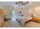 Bright bedroom with a comfortable bed and access to balcony at 9210 Southern Breeze Dr, Orlando, FL 32836