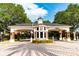 Gated entrance to the community with brick columns and a covered entryway at 9210 Southern Breeze Dr, Orlando, FL 32836