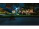 House exterior, nighttime view, with manicured lawn at 9210 Southern Breeze Dr, Orlando, FL 32836