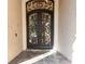 Ornate double iron front doors with glass inserts at 9210 Southern Breeze Dr, Orlando, FL 32836