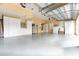 Spacious garage with overhead storage and epoxy flooring at 9210 Southern Breeze Dr, Orlando, FL 32836