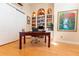 Spacious home office features built-in shelving and hardwood floors at 9210 Southern Breeze Dr, Orlando, FL 32836
