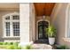 Elegant entrance with ornate double doors and stone columns at 9210 Southern Breeze Dr, Orlando, FL 32836