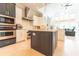 Modern kitchen with island, double oven, and breakfast bar at 9210 Southern Breeze Dr, Orlando, FL 32836