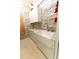 Bright laundry room with farmhouse sink and cabinets at 9210 Southern Breeze Dr, Orlando, FL 32836