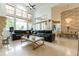 Open floorplan living room with leather sectional sofa and marble floors at 9210 Southern Breeze Dr, Orlando, FL 32836