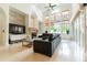 Spacious living area with a fireplace and large windows at 9210 Southern Breeze Dr, Orlando, FL 32836