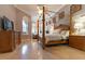 Large main bedroom with four-poster bed and ample space at 9210 Southern Breeze Dr, Orlando, FL 32836