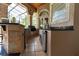 Outdoor kitchen with stainless steel appliances and stone countertops at 9210 Southern Breeze Dr, Orlando, FL 32836