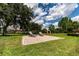 Brick paver patio with lounge chairs in a sunny backyard at 9210 Southern Breeze Dr, Orlando, FL 32836