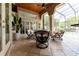 Covered patio with comfortable seating overlooking the pool at 9210 Southern Breeze Dr, Orlando, FL 32836