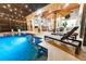 Night view of a relaxing pool with lounge chairs at 9210 Southern Breeze Dr, Orlando, FL 32836