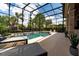 Relaxing pool area with covered patio, spa, and string lights at 9210 Southern Breeze Dr, Orlando, FL 32836