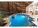 Inviting pool at night with lights and a spa at 9210 Southern Breeze Dr, Orlando, FL 32836