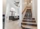 Elegant staircase with marble steps leading to the upper level at 9210 Southern Breeze Dr, Orlando, FL 32836