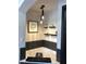 Stylish bathroom featuring a modern tub with black tile accents and contemporary light fixture at 1322 Seven Eagles Ct # 101, Reunion, FL 34747