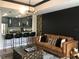 Stylish living space blending the kitchen and living room with modern design elements at 1322 Seven Eagles Ct # 101, Reunion, FL 34747