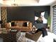 Contemporary living room showcasing a brown couch, coffee table, and sophisticated wall art at 1322 Seven Eagles Ct # 101, Reunion, FL 34747