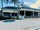 Outdoor patio featuring a hot tub and covered seating area near the pool at 1322 Seven Eagles Ct # 101, Reunion, FL 34747