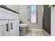 Bathroom featuring a toilet and white granite vanity at 5317 Micco St, Kissimmee, FL 34746
